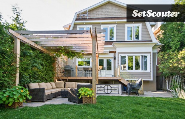 Dorin's backyard haven is a source of great pride in her home. The back deck and pergola were custom built and look gorgeous against the manicured lawn. The space is wide and can host several outdoor scenes.