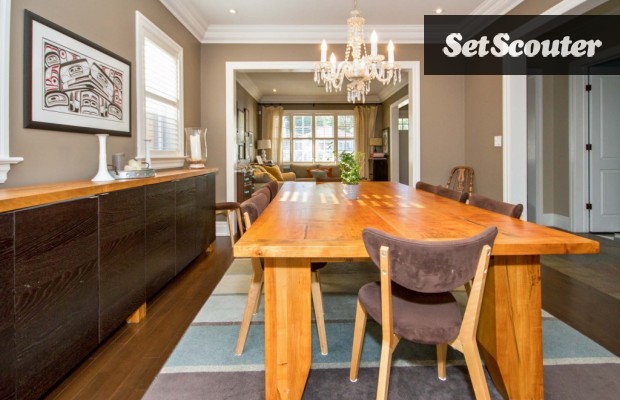 This farmhouse-inspired dining room is full of natural light. The gorgeous wood furniture and flooring both contrast and compliment each other. The open-concept living-dining room allows for ample space to accommodate several camera angles.