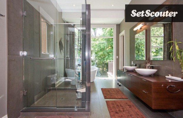 Lilliana's master bath is serene and spa-like with neutral tones. The large walk-in shower allows for multiple-angle shots, while the soaker tub is placed perfectly in front of a large window.