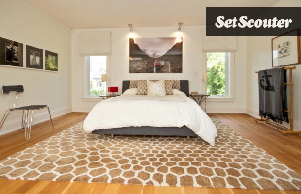 Angeline's master bedroom is spacious and bright. The white walls and hardwood floors allow for great versatility. The minimalist look and low bed never go out of style.