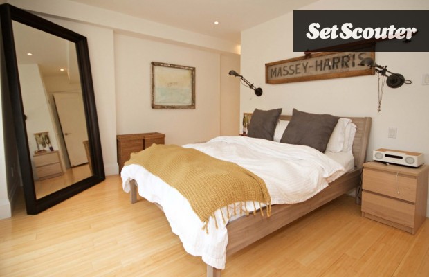 Monica's master bedroom is sleek and minimalist. The light, neutral colours are earthy and provide a versatile backdrop. This room can be easily dressed and used for a variety of productions.