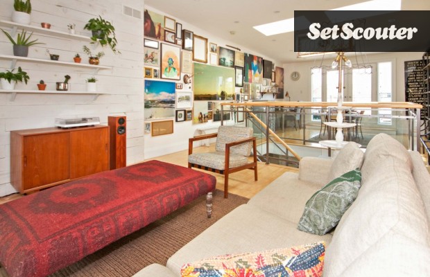 Monica's top floor is a gorgeous gallery of local Toronto art. The white exposed brick, skylight and open-concept floor plan make this space bright and airy.