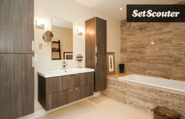 Leslie's master bath is chic and minimalist. Rich colours are highlighted, giving this space a unique and high-end look. This spa-like bathroom is luxurious with its earthy toned marble wall. With great lighting and stunning details, this master bath is a true gem.