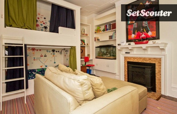 Timothy’s charming kids room features neutral tones with bold pops of colour. This space is playful and features trendy design elements such as modern built-in bunk beds and a multi-coloured striped rug. This space can be kept as is, or the couch can easily be removed to allow for more shooting space!