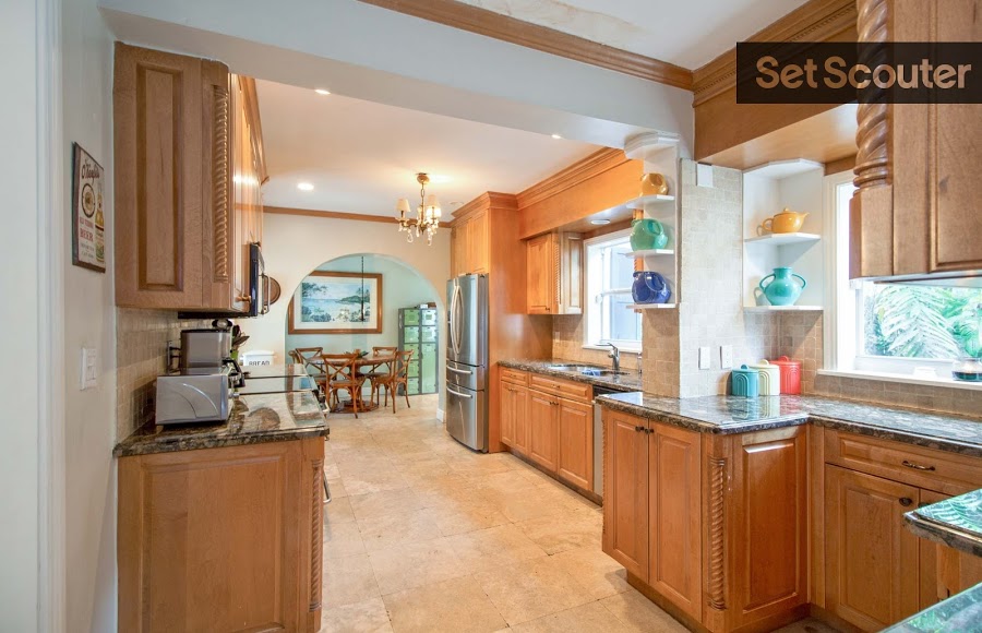 Alison's kitchen is warm and charming, with beautiful wood cabinets and trimming. The large windows flood the space with natural light, making it feel airy and open. This family kitchen has a unique layout which great for multiple shooting angles!
