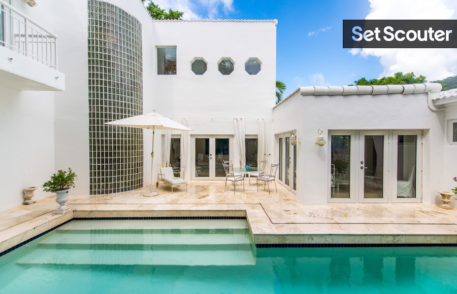 This stylish backyard has all the right elements to make it the ultimate entertaining space! The warm marble tiling surrounding Pascal's pool offsets the white exterior, making this sleek space trendy. The unique windows add to the home's contemporary design while the balcony allows for wide shots of Pascal’s gorgeous outdoor space!
