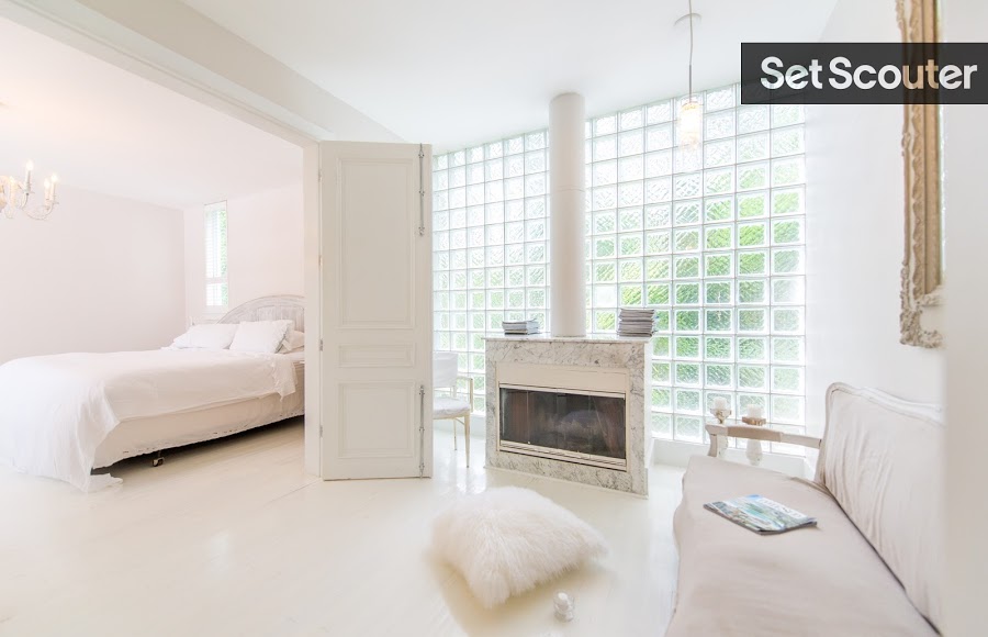 This spacious master bedroom has a high-end look that’s undeniably posh. From the charming chandelier to the modern fireplace, Pascal’s bedroom is absolutely breathtaking! Close the french doors and the unique fireplace stands in a makeshift additional room!