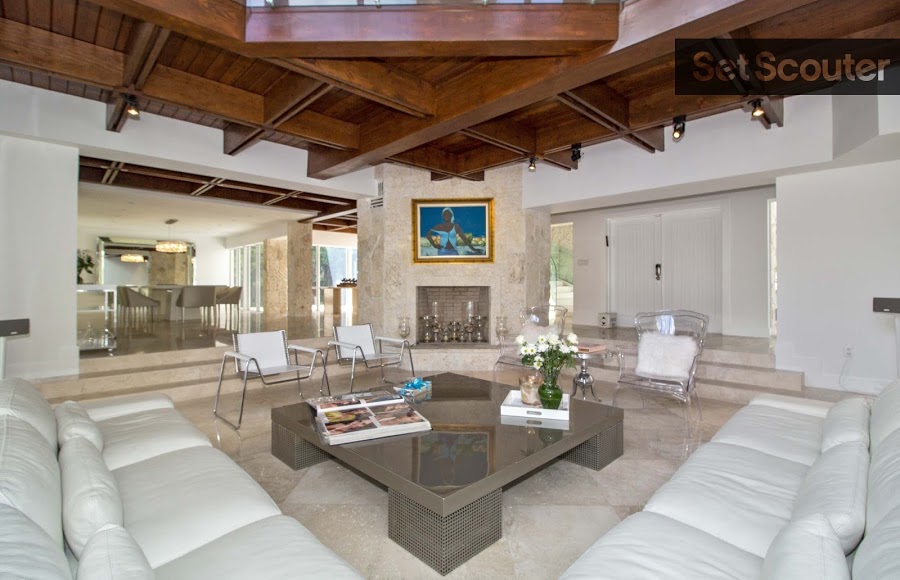 Rafael’s living room is stunning, with its stylish white decor and contemporary furniture! The unique and open layout allows the extravagant fireplace to act as the focal point, while the gorgeous wood ceiling adds a rustic appeal. This trendy living room has a high-end style that makes it the perfect backdrop to a bachelor pad scene!