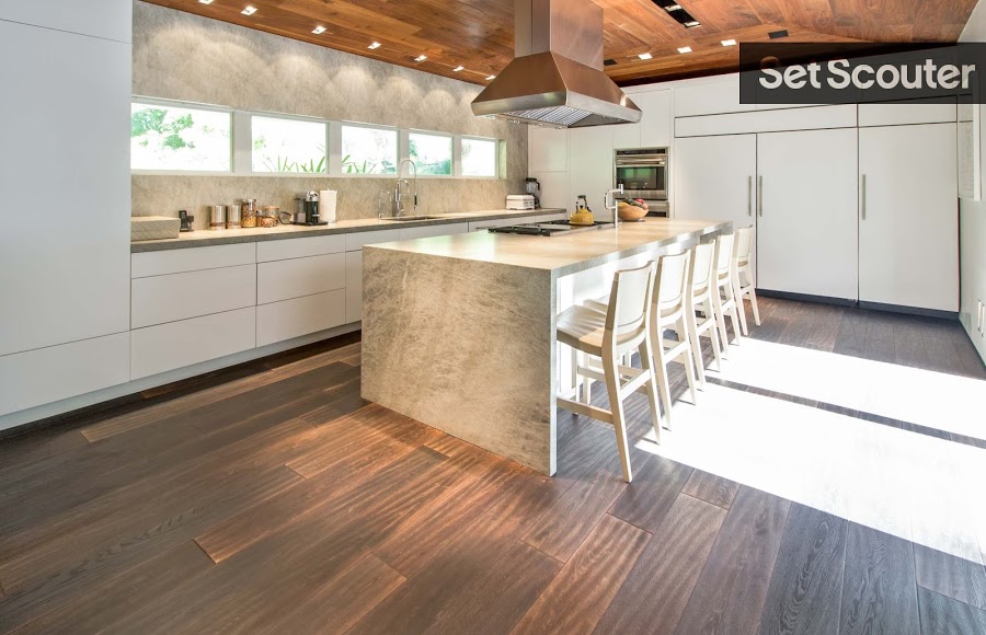 Jan’s kitchen is chic and modern. Using wood for both the ceiling and floors. Jan has created a unique style radiating modern flair and enlightenment. Hefty additions like the stainless steel vent and kitchen island block show form and detailed execution.