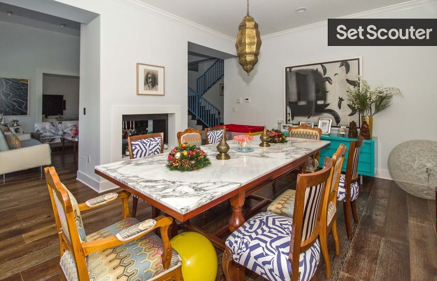 Ana’s open dining area is sporting an island vibe with bright colors and patterns. High ceilings and classic hardwood floors complement the eclectic feel, keeping the space looking neat and spacious.