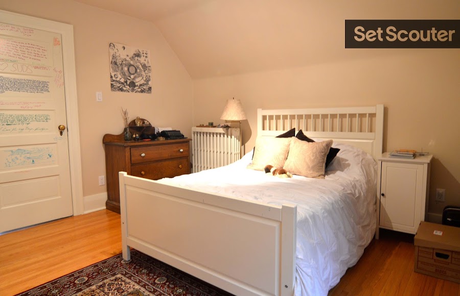 This second bedroom is conservative and simplistic with neutral walls and furniture. It is warm and versatile with a lot of space to accommodate different shooting angles. With minimal furniture, Jackie's room can be dressed to suit any age group and the colourful writing on the door is a great authentic kid's room element!