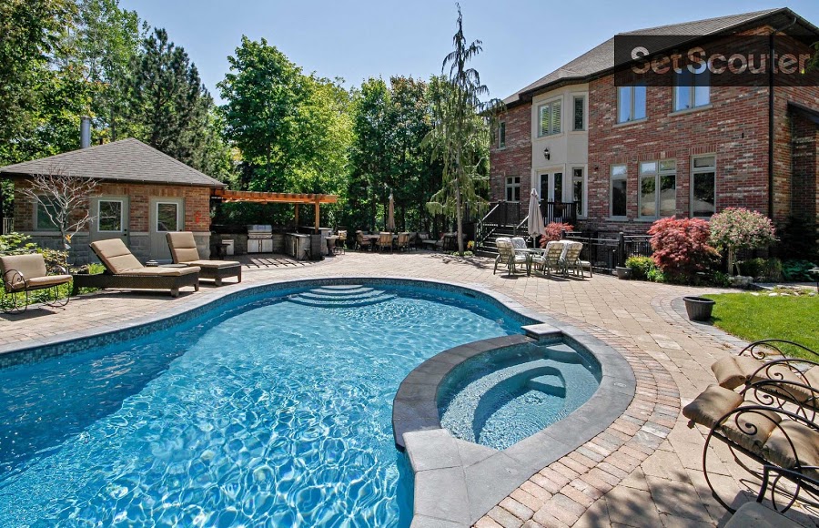 This incredible, classic, modern-day home is complete with an underground pool and super spacious patio. Featuring a charming barbecue pit, pool house and numerous spots for lounging in the sun, Amel's backyard is large and lavish area for a summertime shoot.