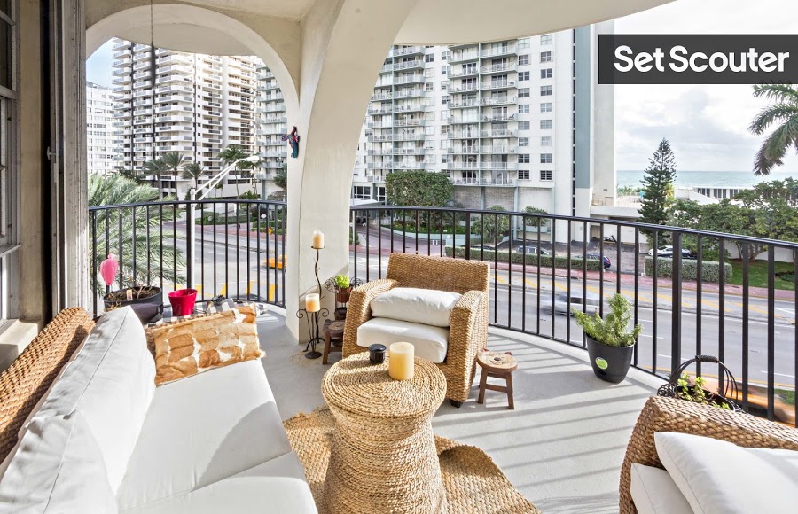 The highlight of this condo is a large well-decorated balcony that overlooks the Atlantic Ocean. Wicker furniture in light tones gives the space a nautical feel that complements the natural scenery.