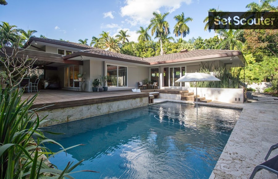 The back of Jan's home opens up into a backyard that is calm and inviting. An underground pool surrounded by natural greenery is the essence of relaxation and bliss. With various elevations and cozy seating areas, Jan has created an at-home, tropical oasis.