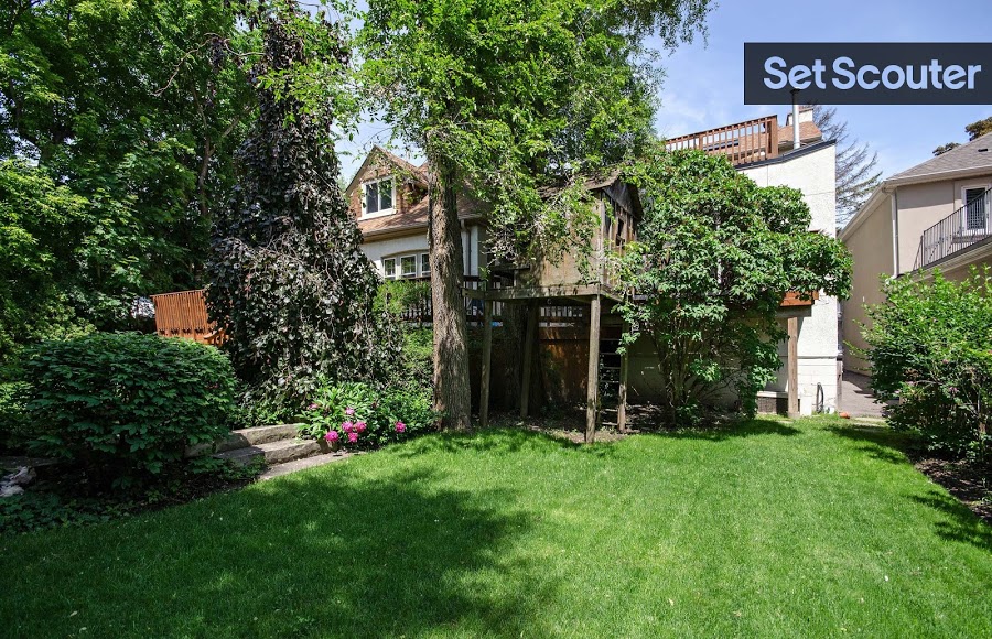 A classic backyard means endless possibilities! A furnished, walk-out deck provides a fantastic view of Rhonda’s lawn and colourful flower garden. Standing tall, front and centre, is an incredible treehouse tucked away under bright green foliage; this backyard is a hidden gem for those shooting in the city.