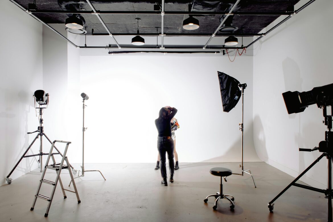 A photo of a photographer shooting in a photo studio.
